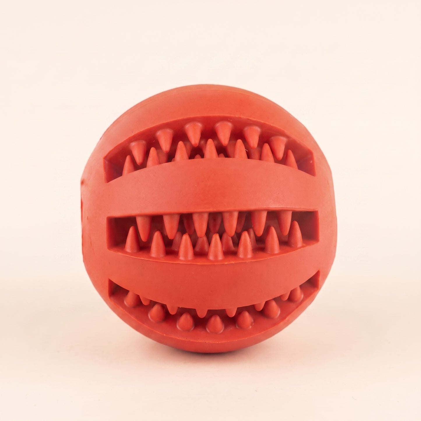 Rubber Treat Ball with Teeth-Cleaning Grooves in red