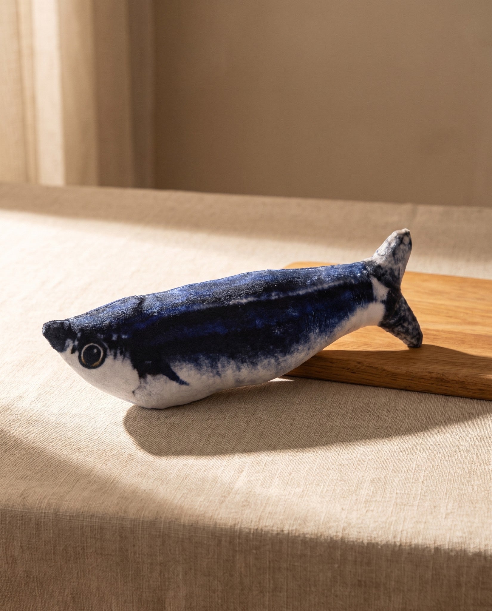 Flopping Fish Cat Toy, Rechargeable and Tap-Activated, styled in a home setting