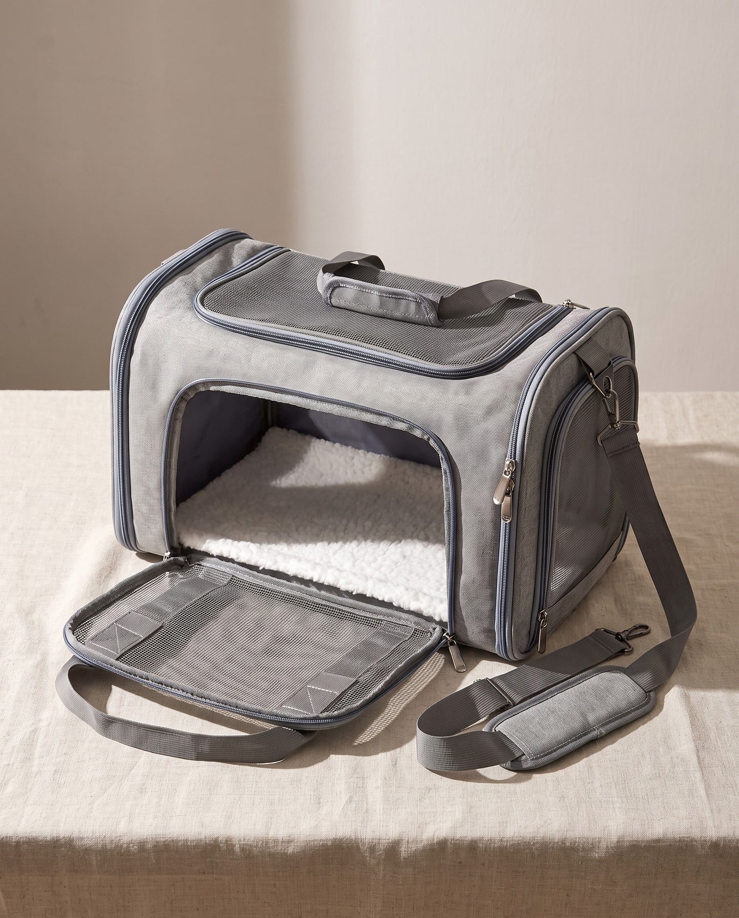 Soft-Sided Collapsible Pet Carrier, styled in a home setting
