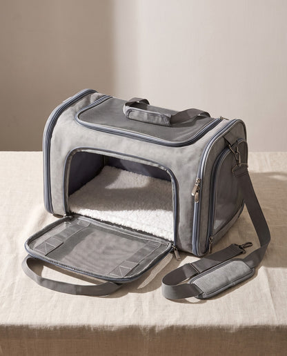 Soft-Sided Collapsible Pet Carrier, styled in a home setting