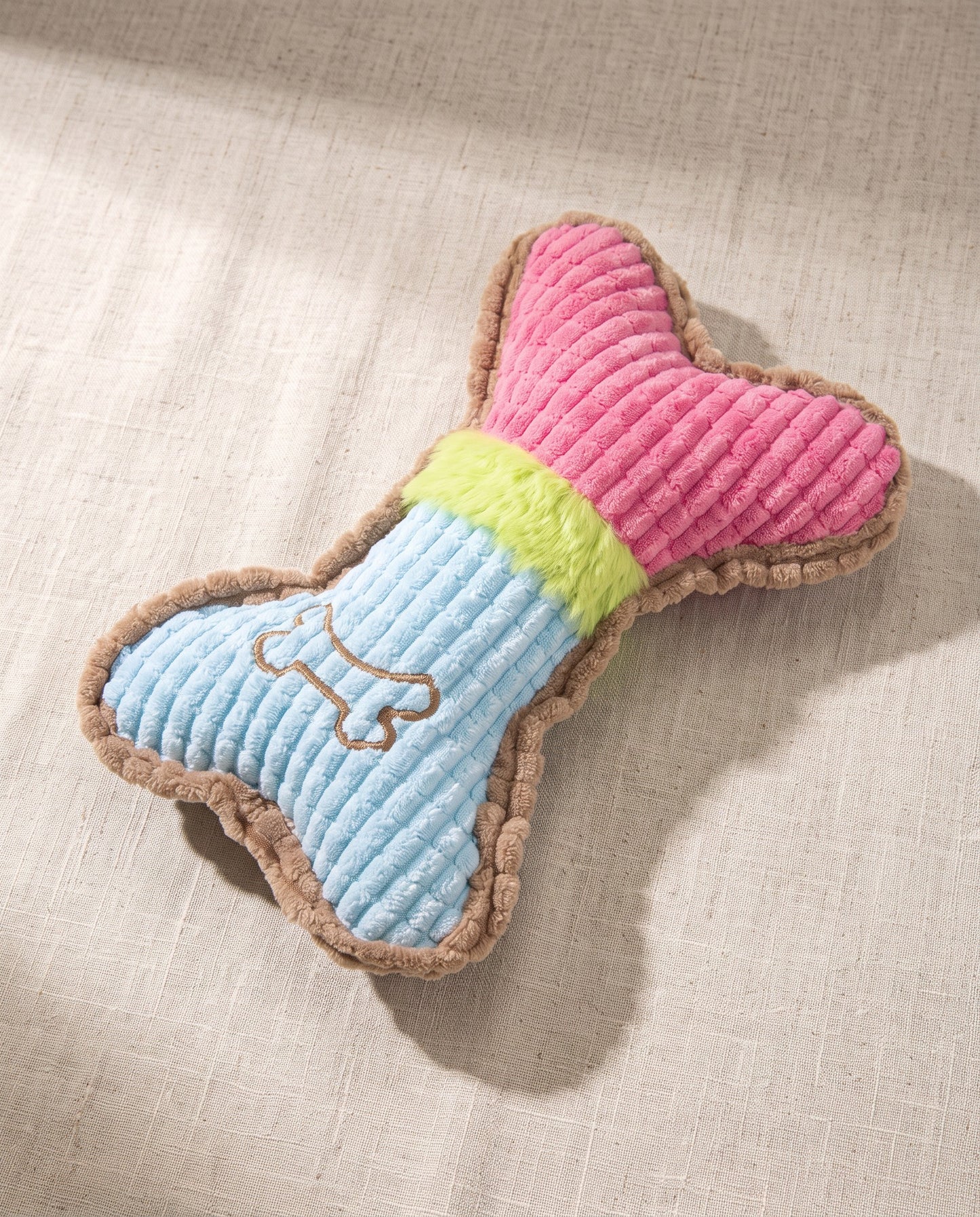 Squeaky Plush Bone Toy for Dogs, styled in a home setting