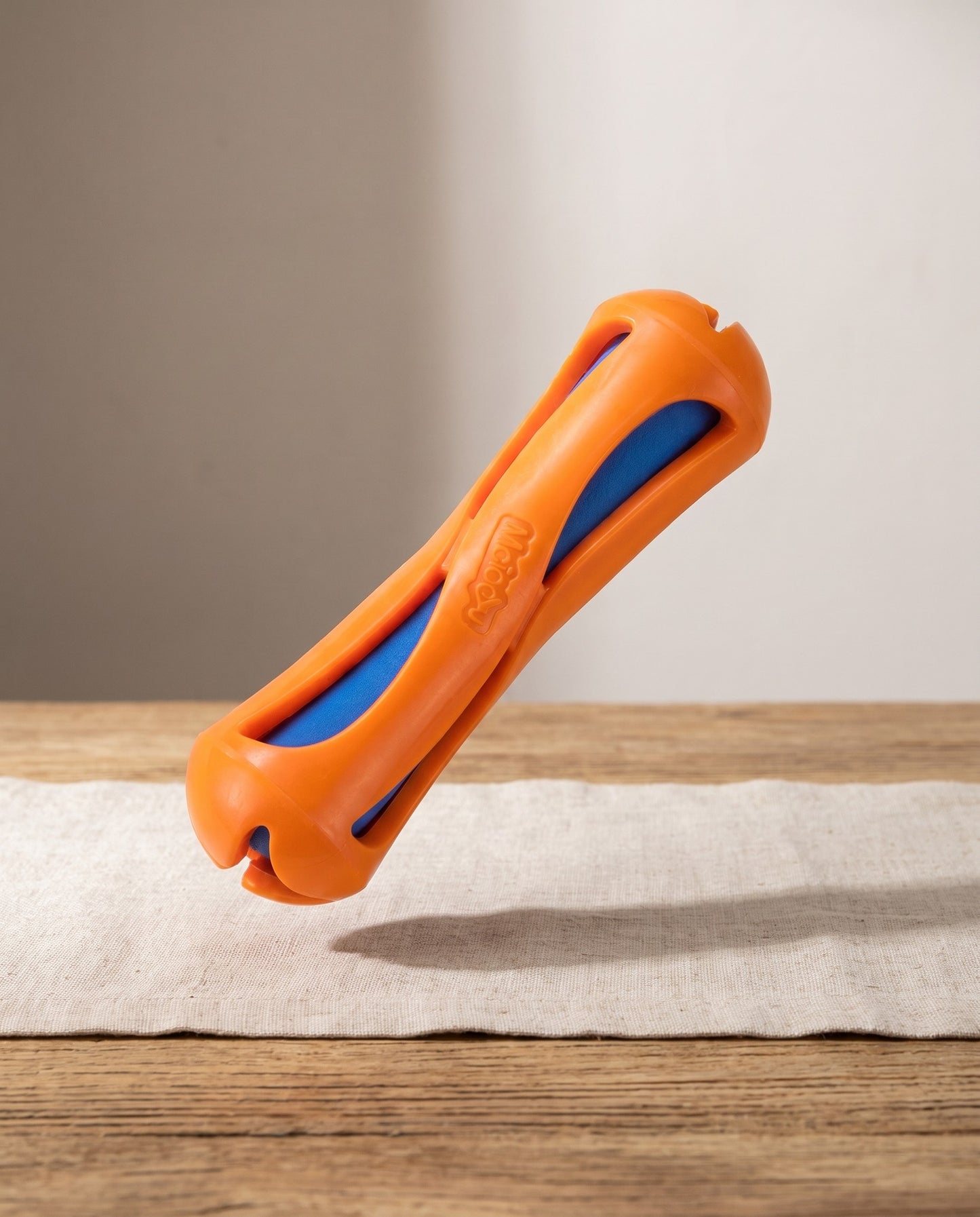 Floating Fetch Stick for Dogs, Teeth-Cleaning Groove, styled in a home setting