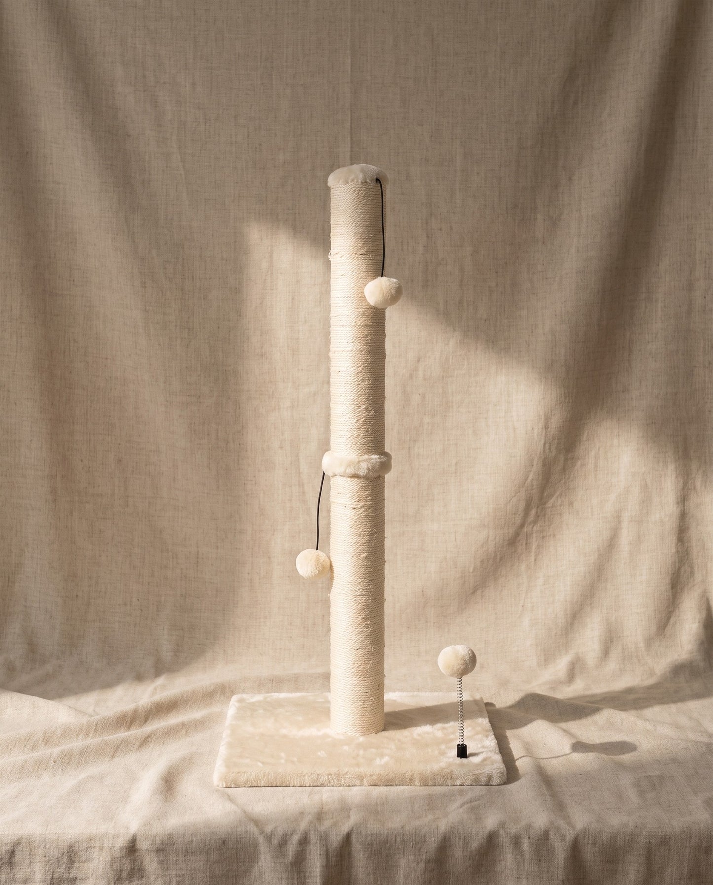 Tall Sisal Cat Scratching Post with Ball, styled in a home setting