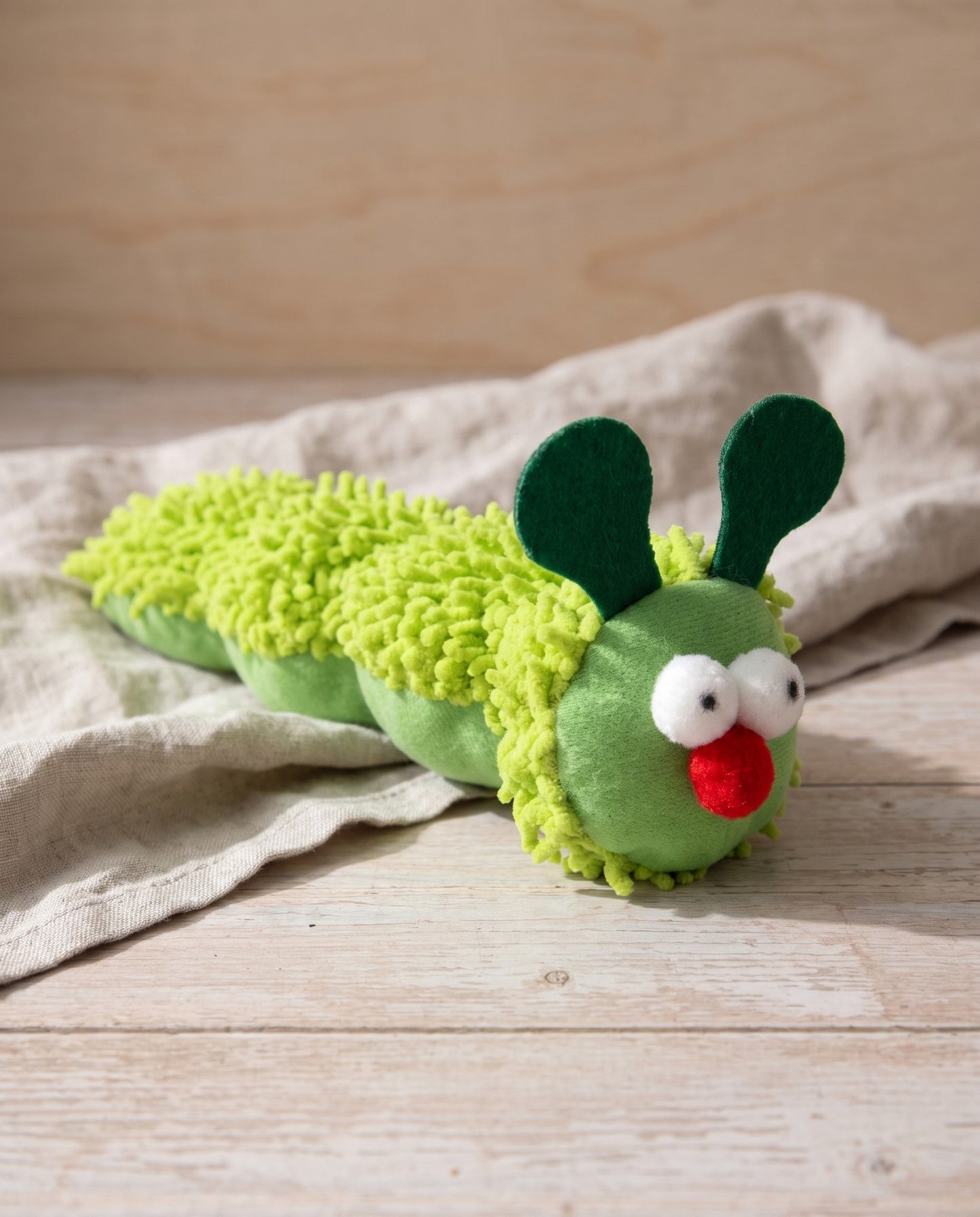 Caterpillar Catnip Kicker Toy for Cats, styled in a home setting