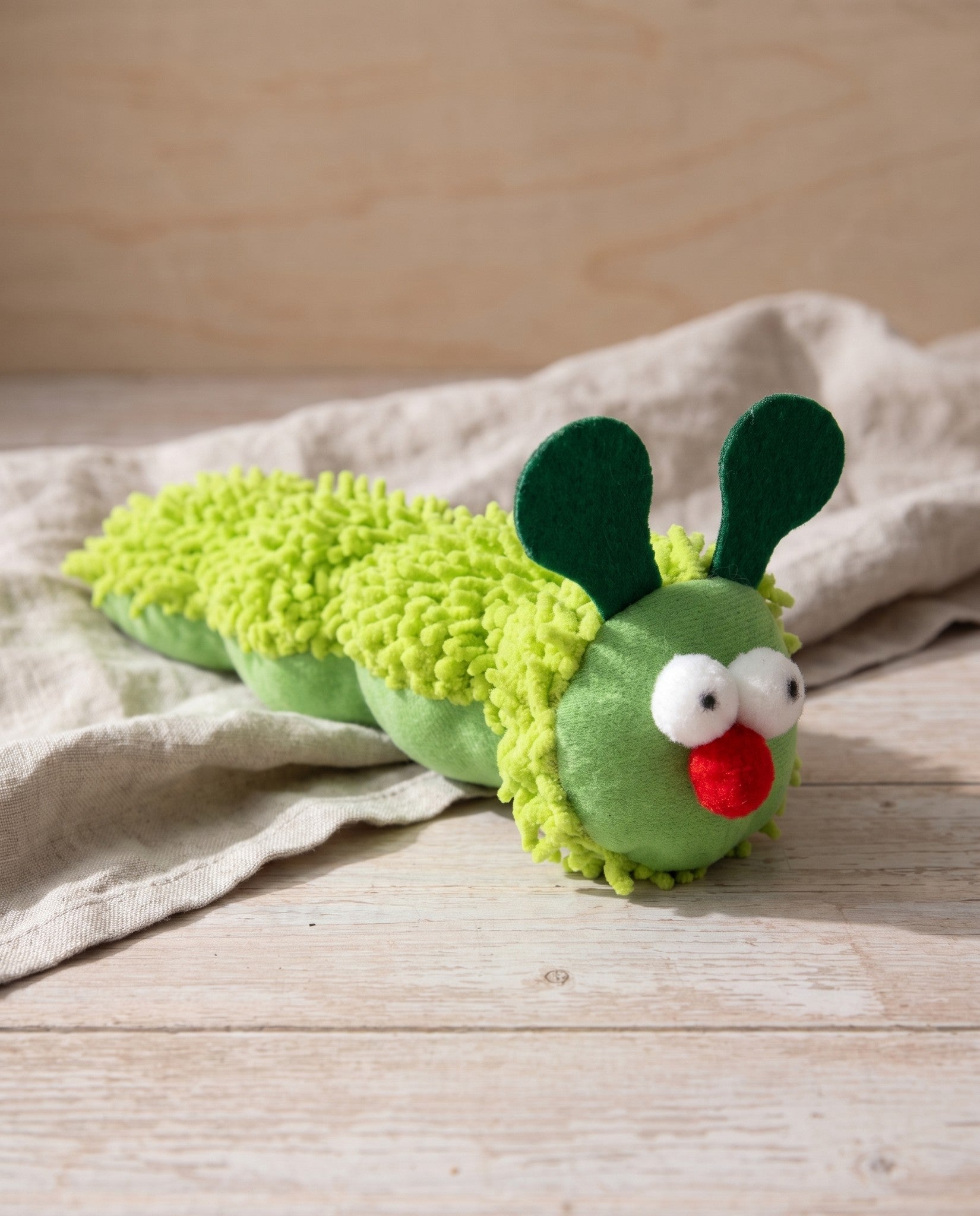 Caterpillar Catnip Kicker Toy for Cats, styled in a home setting