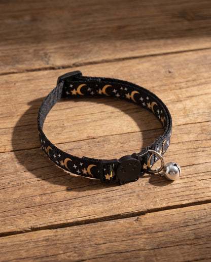 Star and Moon Cat Collar with Bell, styled in a home setting