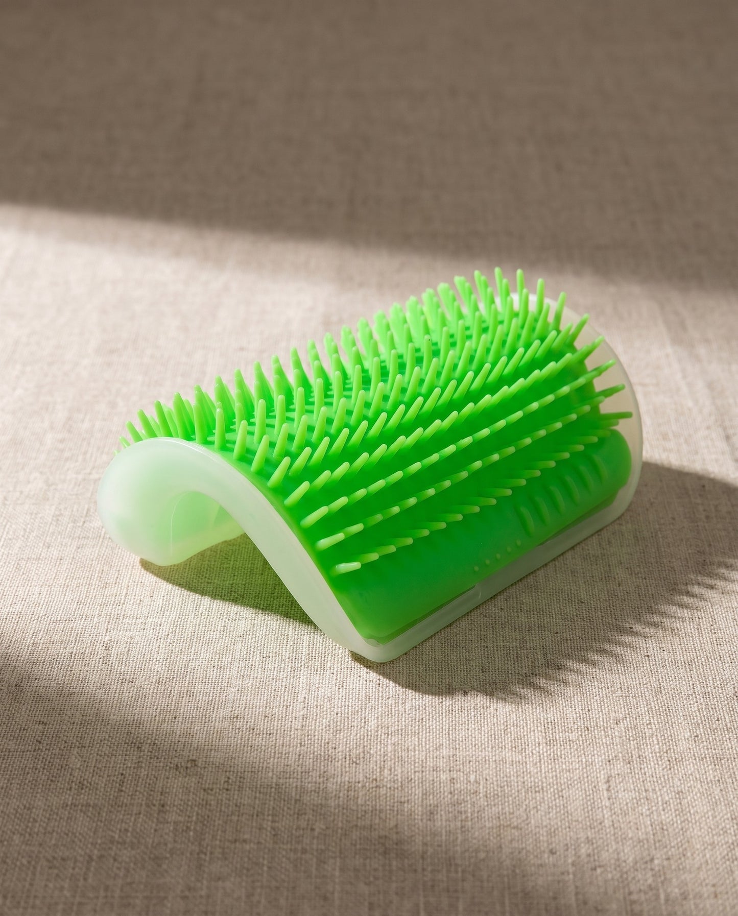 Arched Corner Self-Groomer for Cats, styled in a home setting