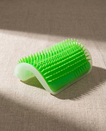 Arched Corner Self-Groomer for Cats, styled in a home setting