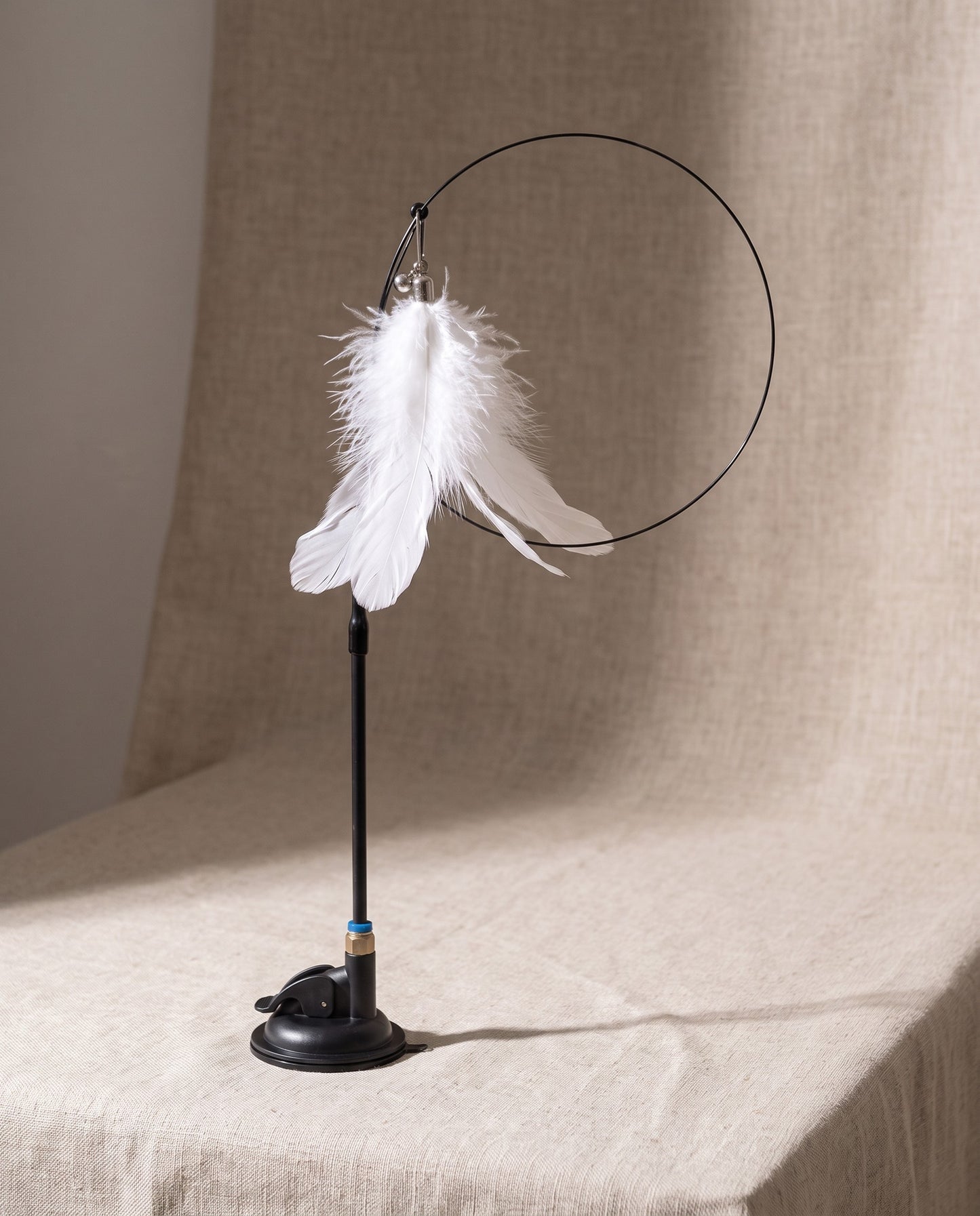 Suction Cup Feather Teaser Wand for Cats, styled in a home setting