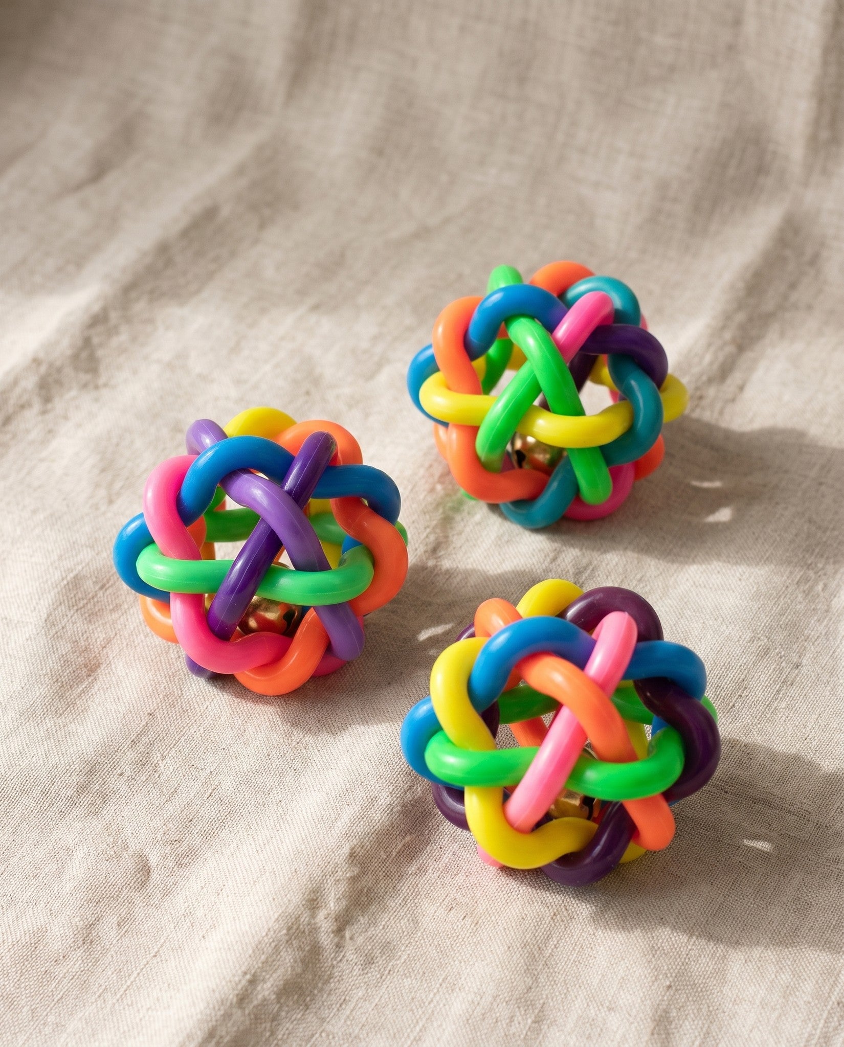 Woven Rubber Bell Ball for Dogs, styled in a home setting