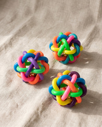 Woven Rubber Bell Ball for Dogs, styled in a home setting