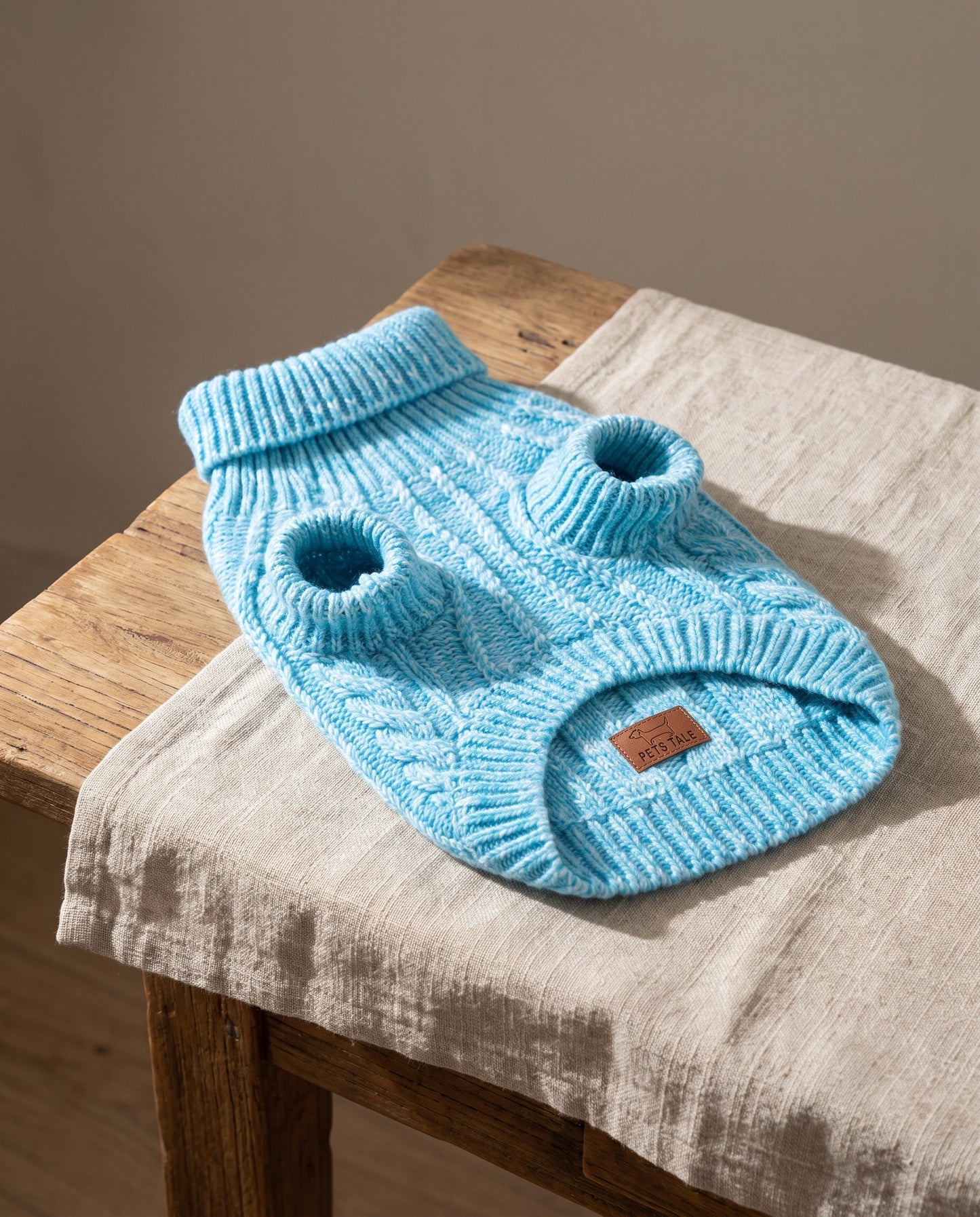Cable-Knit Turtleneck Sweater for Dogs and Cats, styled in a home setting