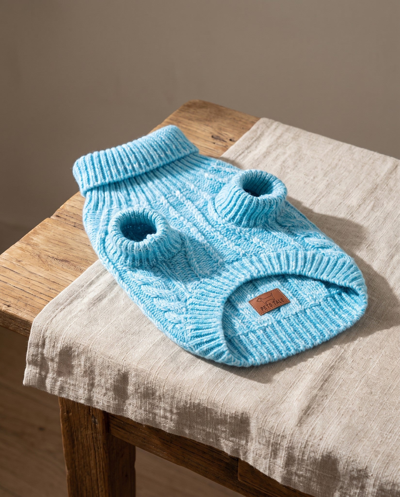 Cable-Knit Turtleneck Sweater for Dogs and Cats, styled in a home setting