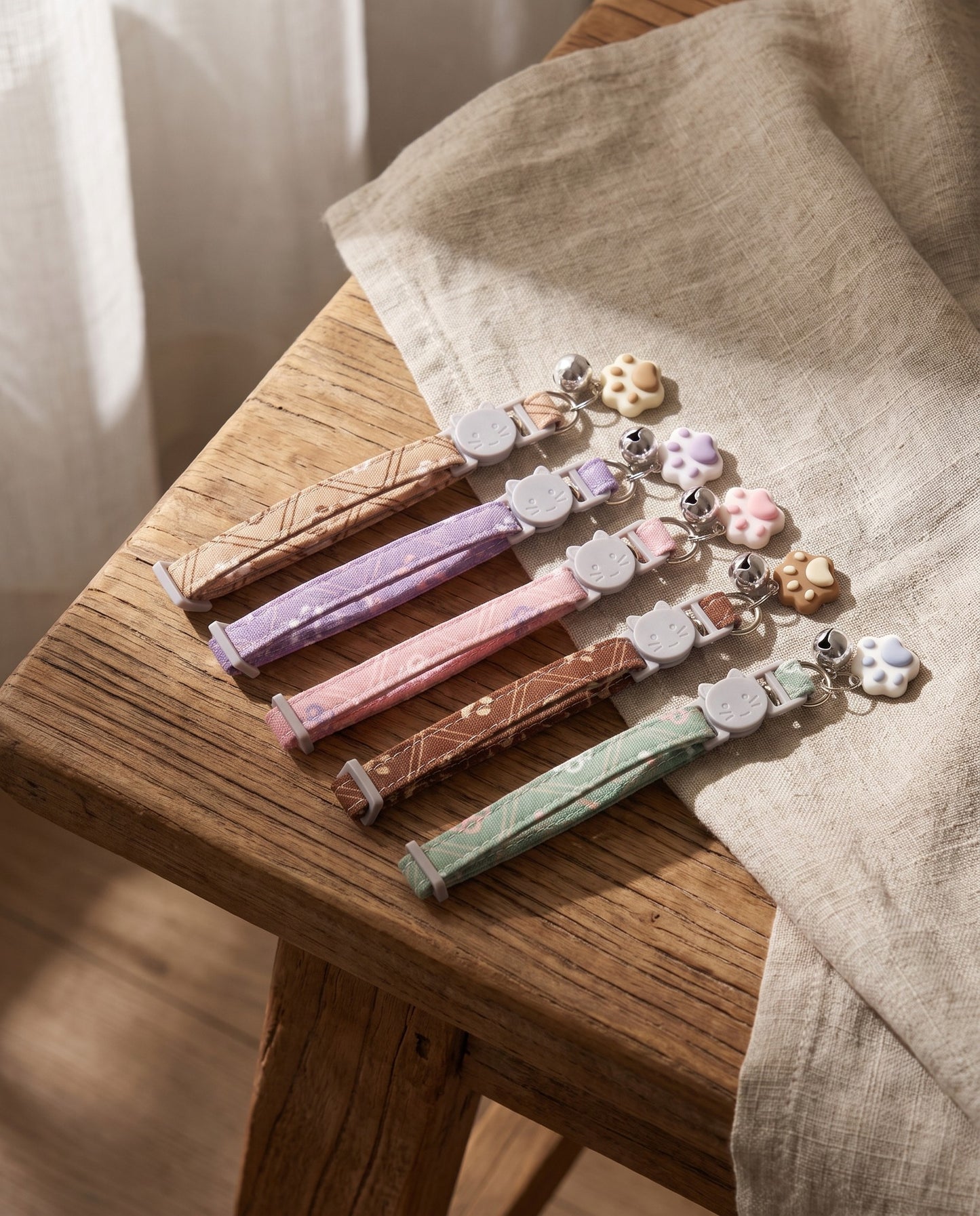 Breakaway Cat Collar with Paw Charm, styled in a home setting