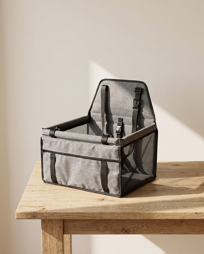 Foldable Booster Car Seat with Safety Tether, styled in a home setting