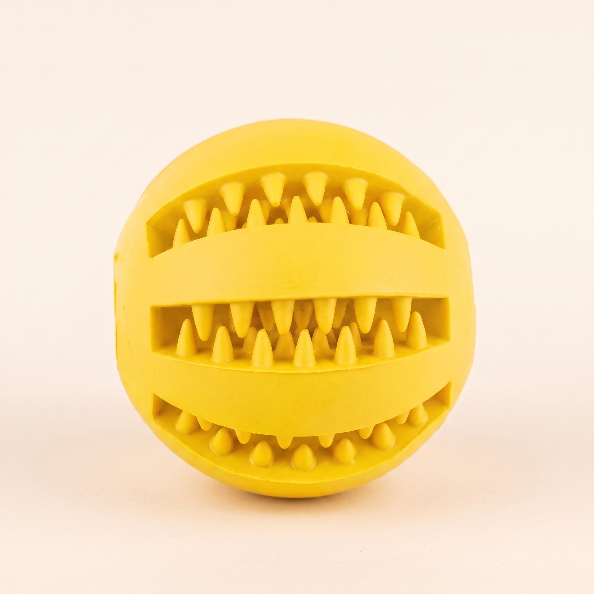 Rubber Treat Ball with Teeth-Cleaning Grooves in yellow