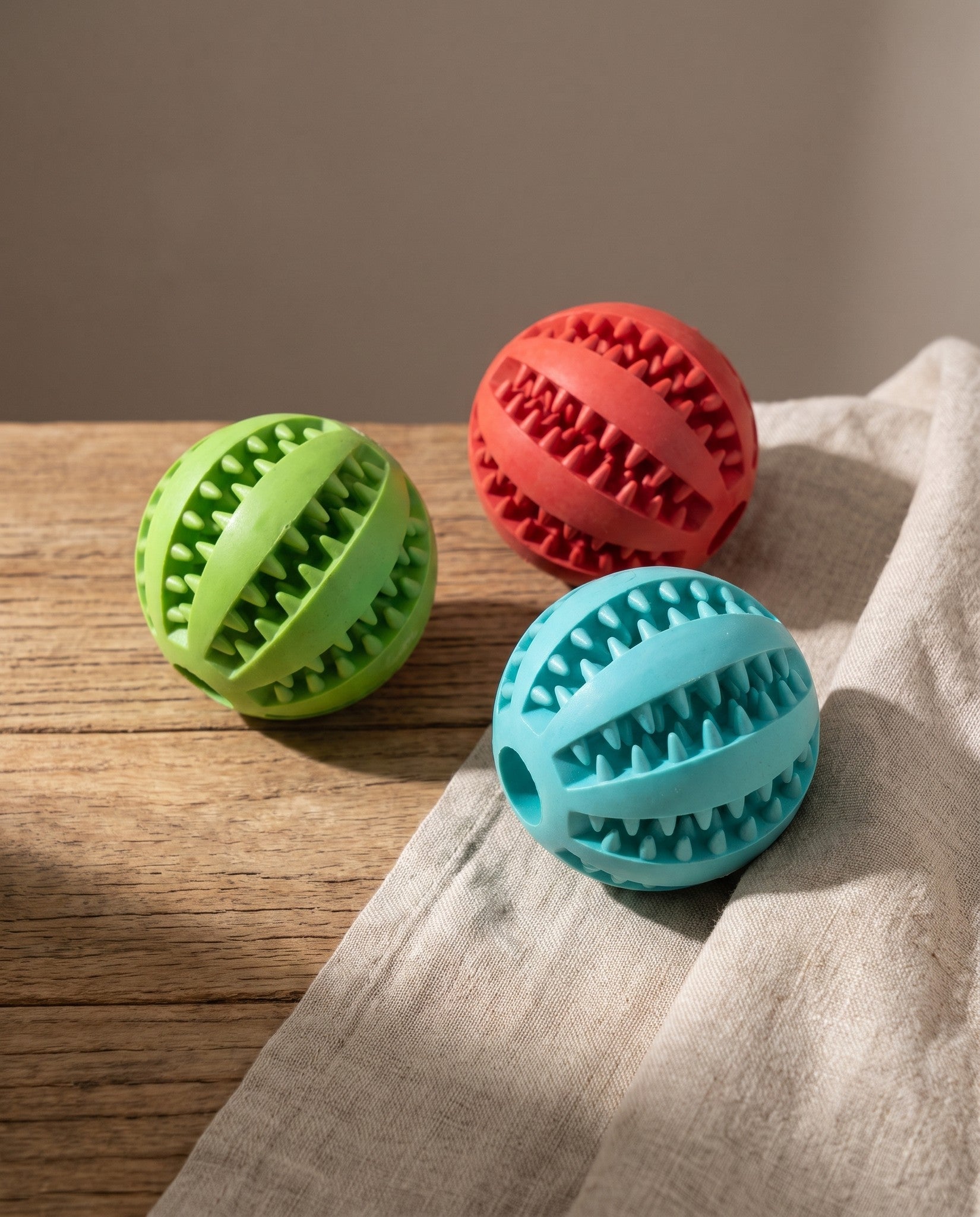 Natural Rubber Treat Dispensing Ball, styled in a home setting