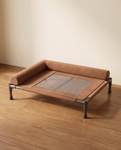 Elevated Cooling Cot Bed with Bolster, styled in a home setting
