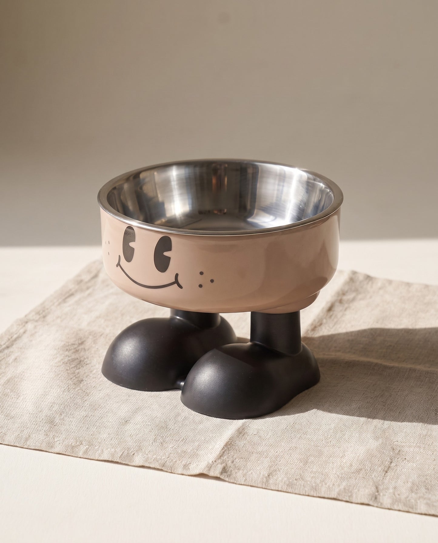 Smiley Elevated Pet Bowl with Steel Insert, styled in a home setting