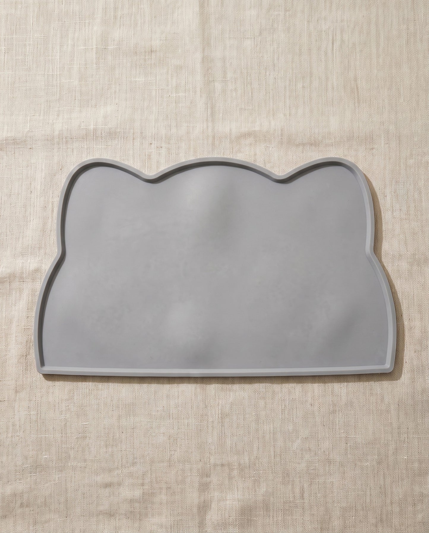 Silicone Feeding Mat with Raised Lip, styled in a home setting