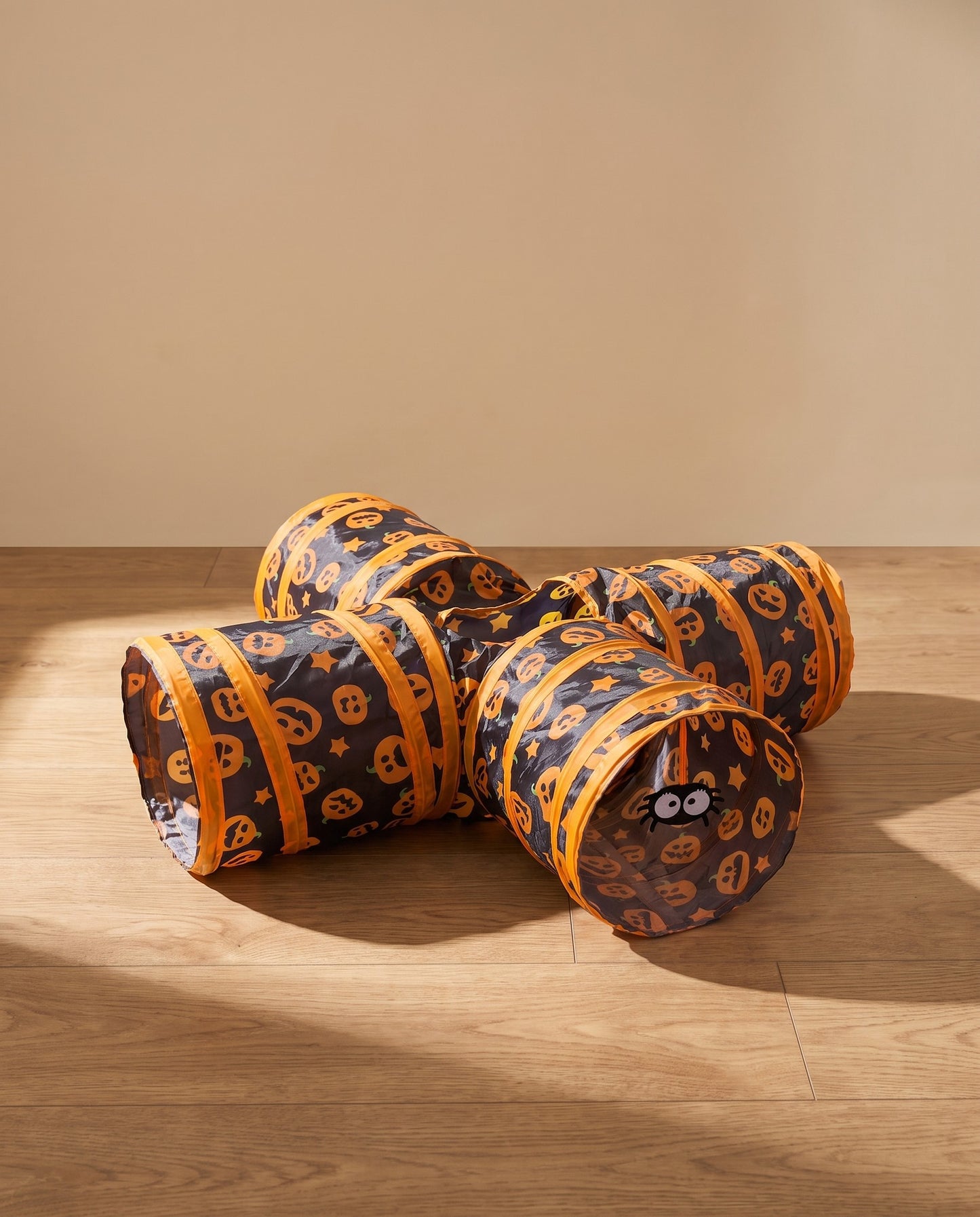 Three-Way Cat Play Tunnel, Pumpkin Print, styled in a home setting