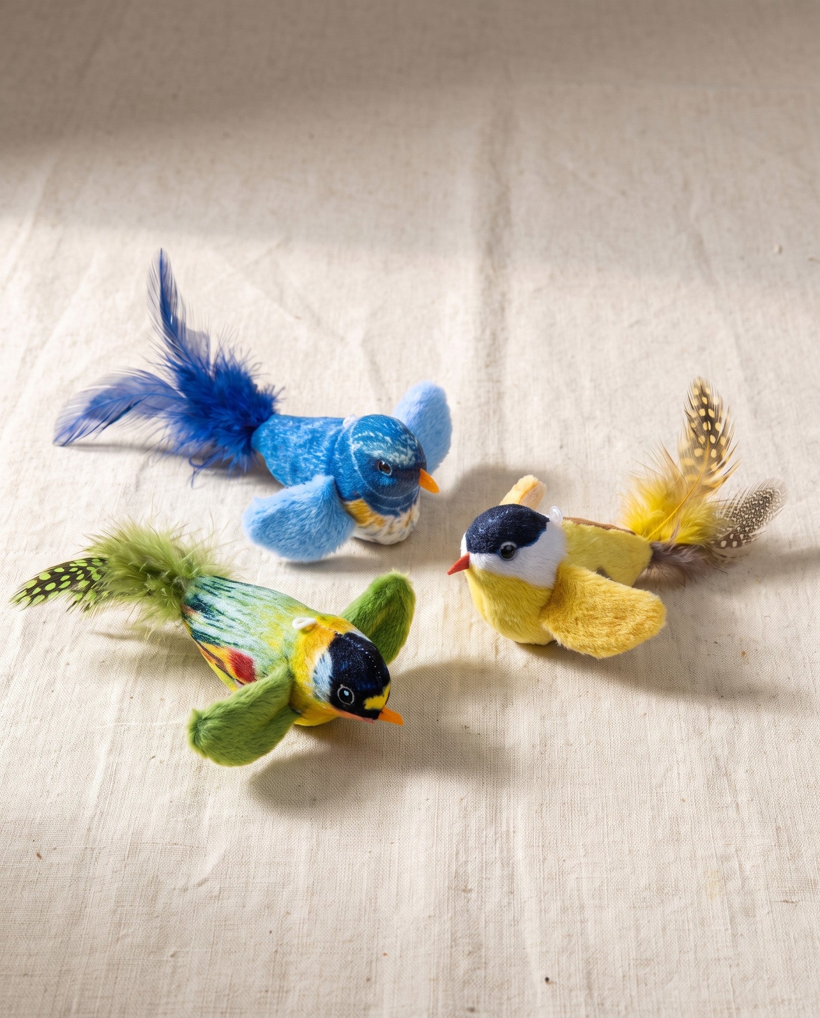 Chirping Feather Bird Cat Toys, styled in a home setting