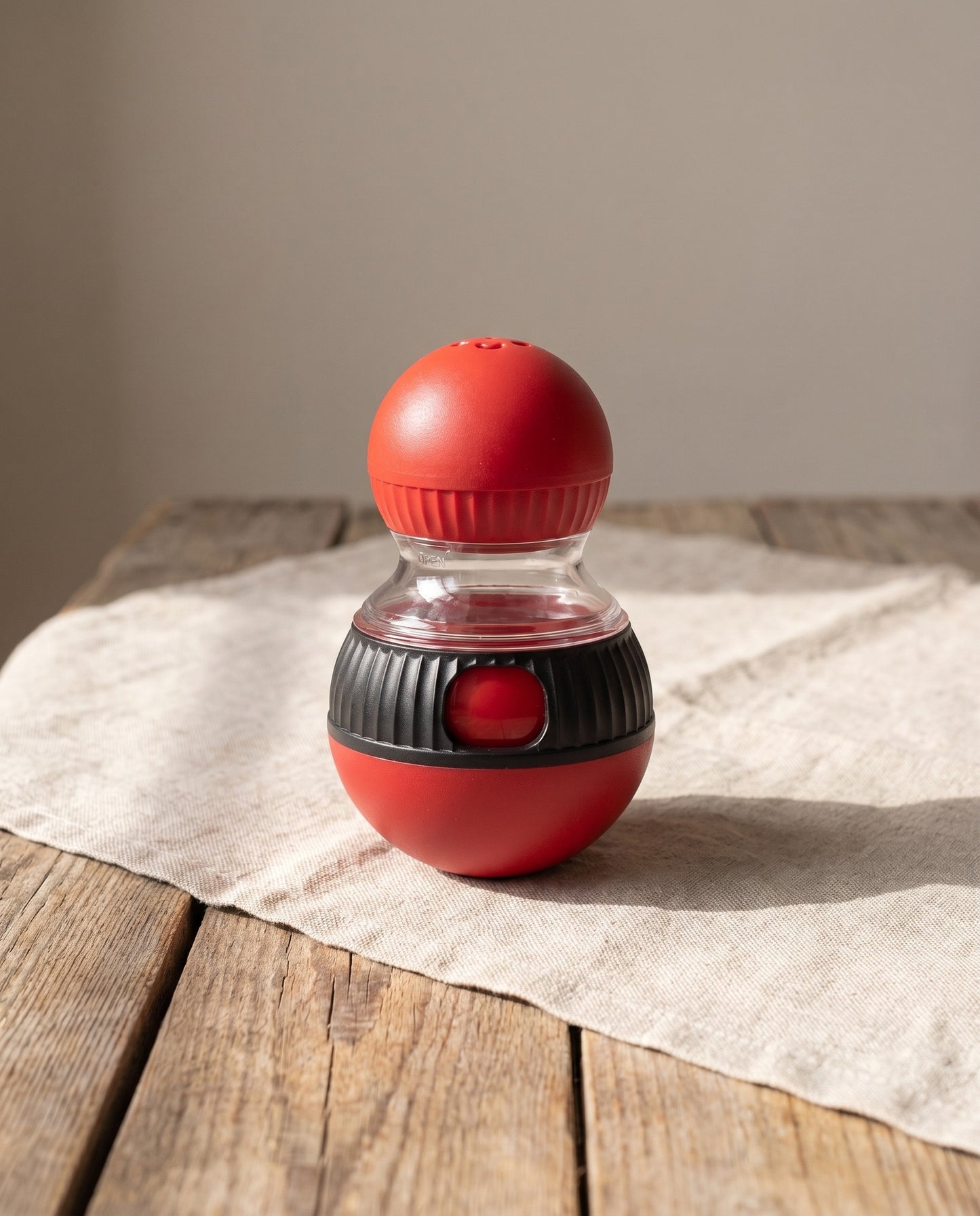 Wobbling Treat Dispenser Cat Toy, styled in a home setting