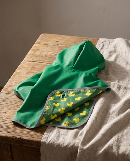 Reversible Hooded Dog Rain Cape, styled in a home setting