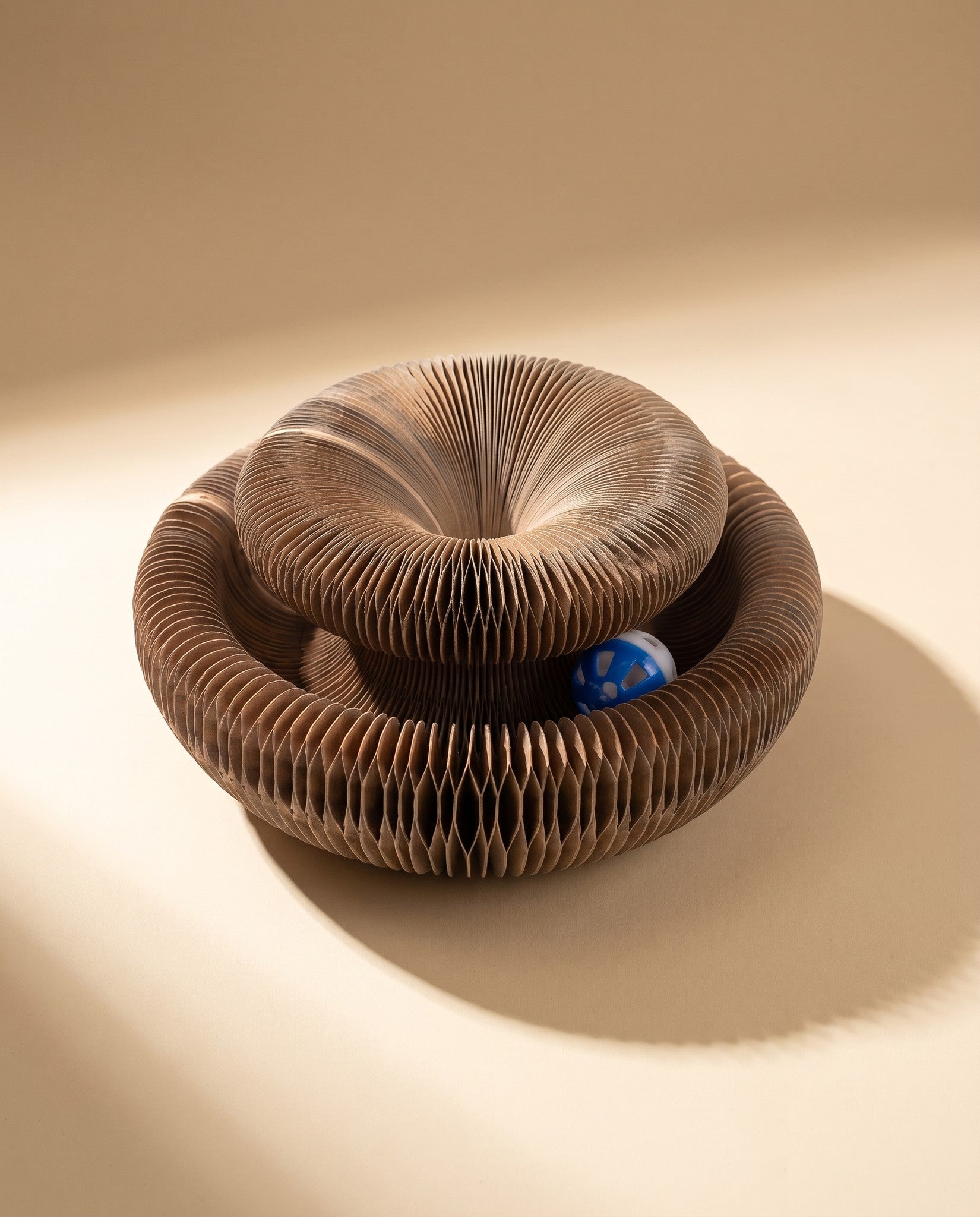 Folding Cardboard Cat Scratcher with Ball Track, styled in a home setting