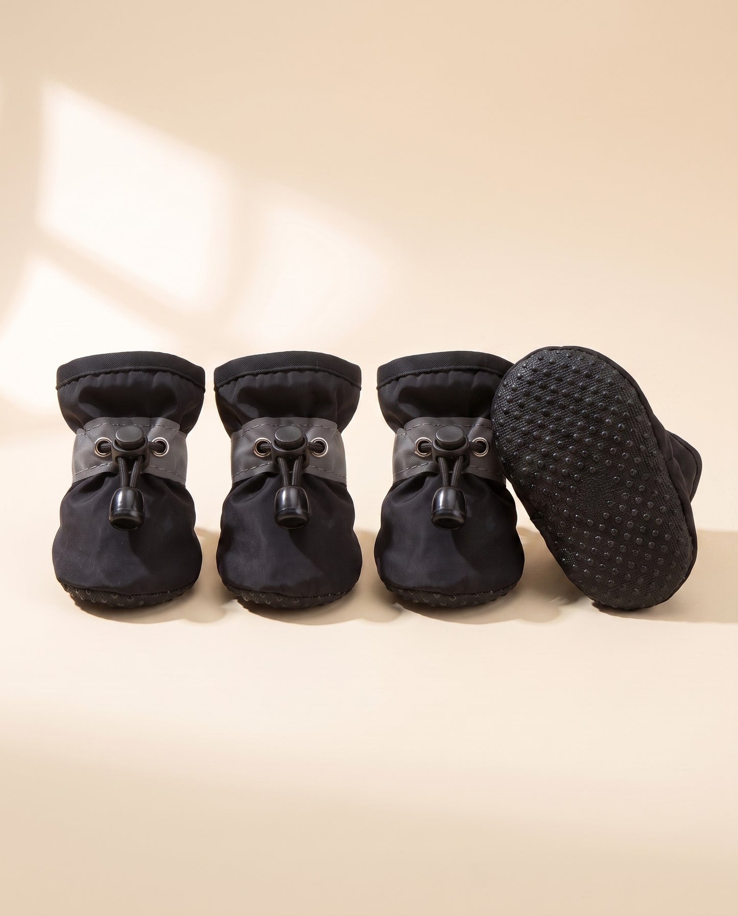 Waterproof Anti-Slip Dog Boots, Set of 4, styled in a home setting