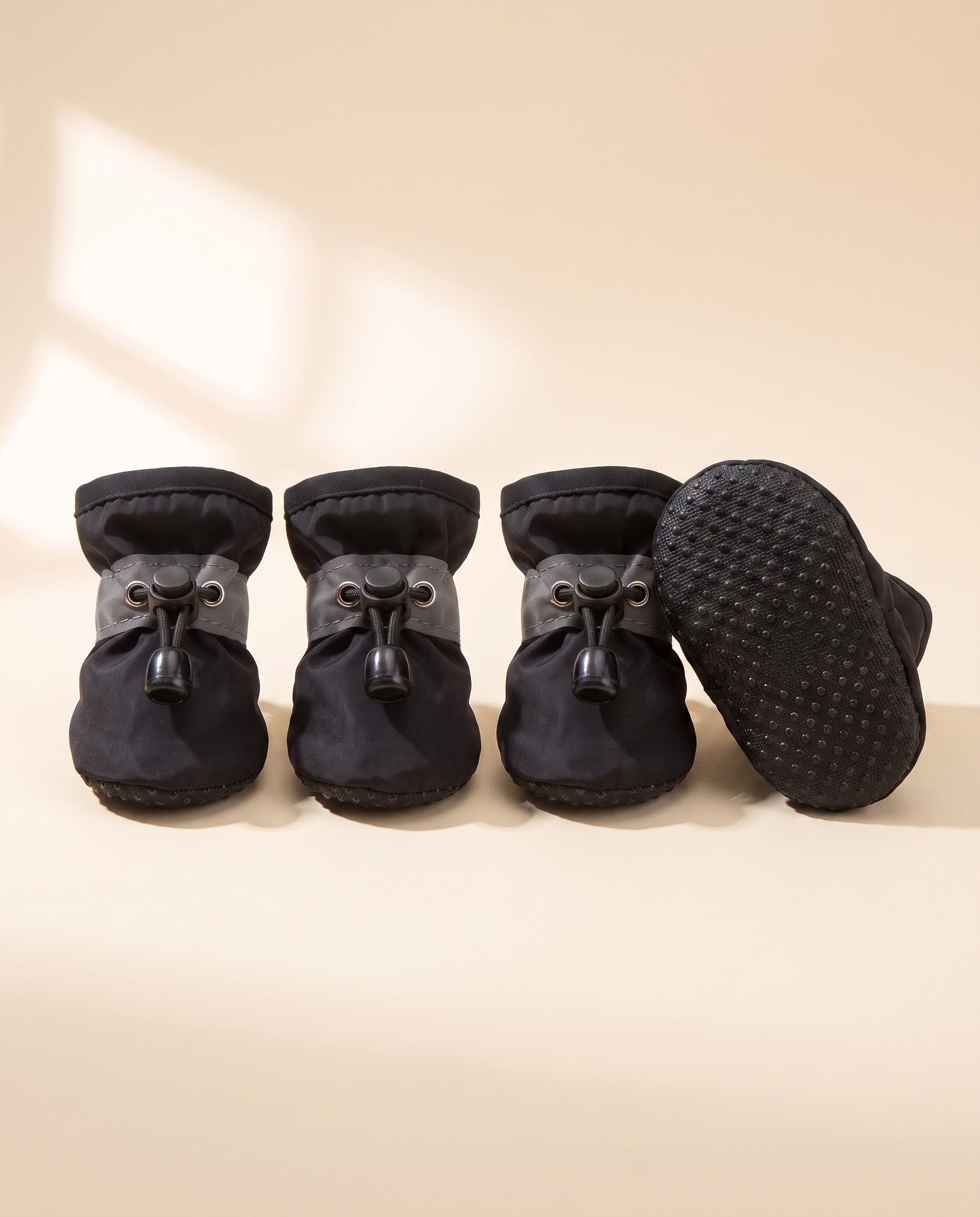 Waterproof Anti-Slip Dog Boots, Set of 4, styled in a home setting