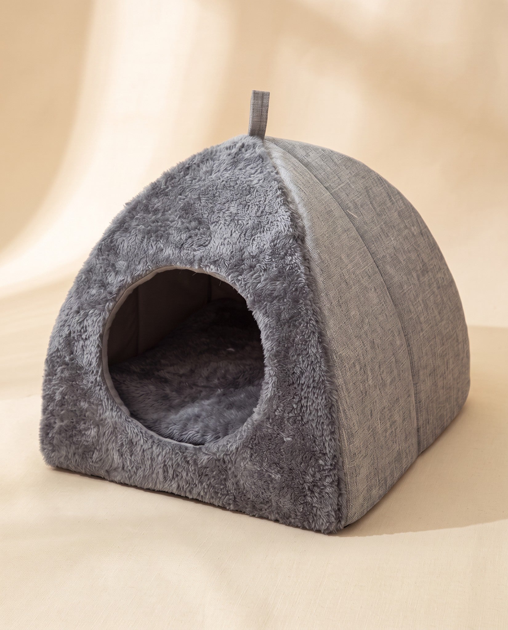 Triangle Felt Cat House, styled in a home setting