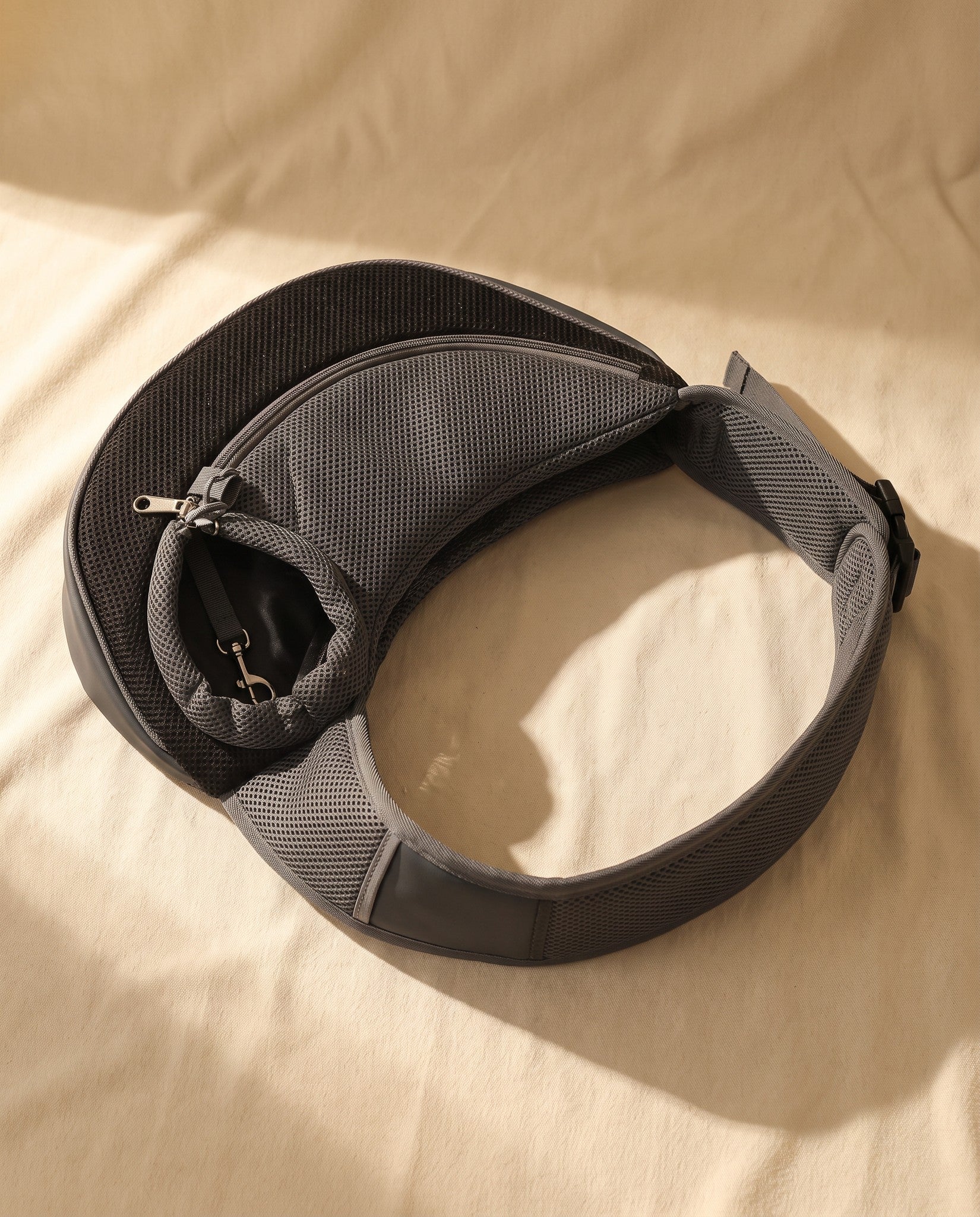 Mesh Sling Carrier with Safety Hook, styled in a home setting