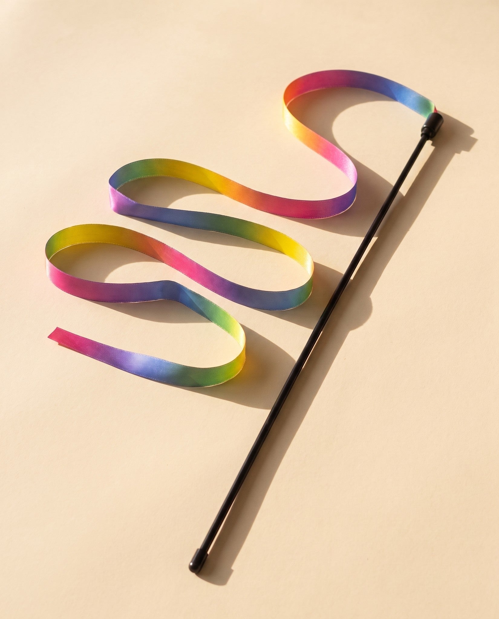 Rainbow Ribbon Teaser Wand, styled in a home setting