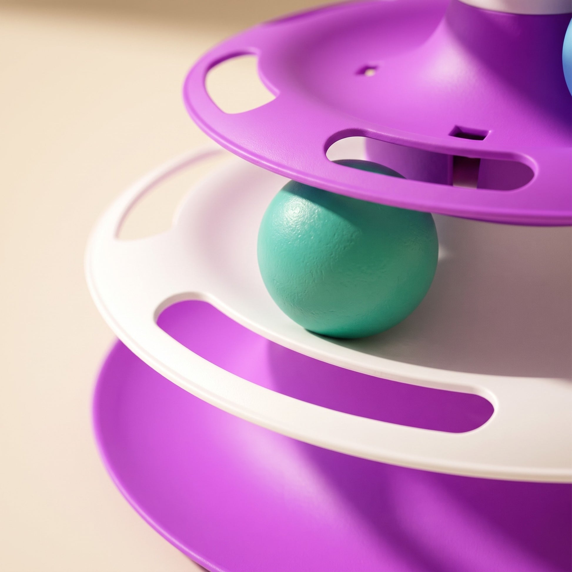 Three-Tier Turntable Cat Toy with Feather, close-up detail