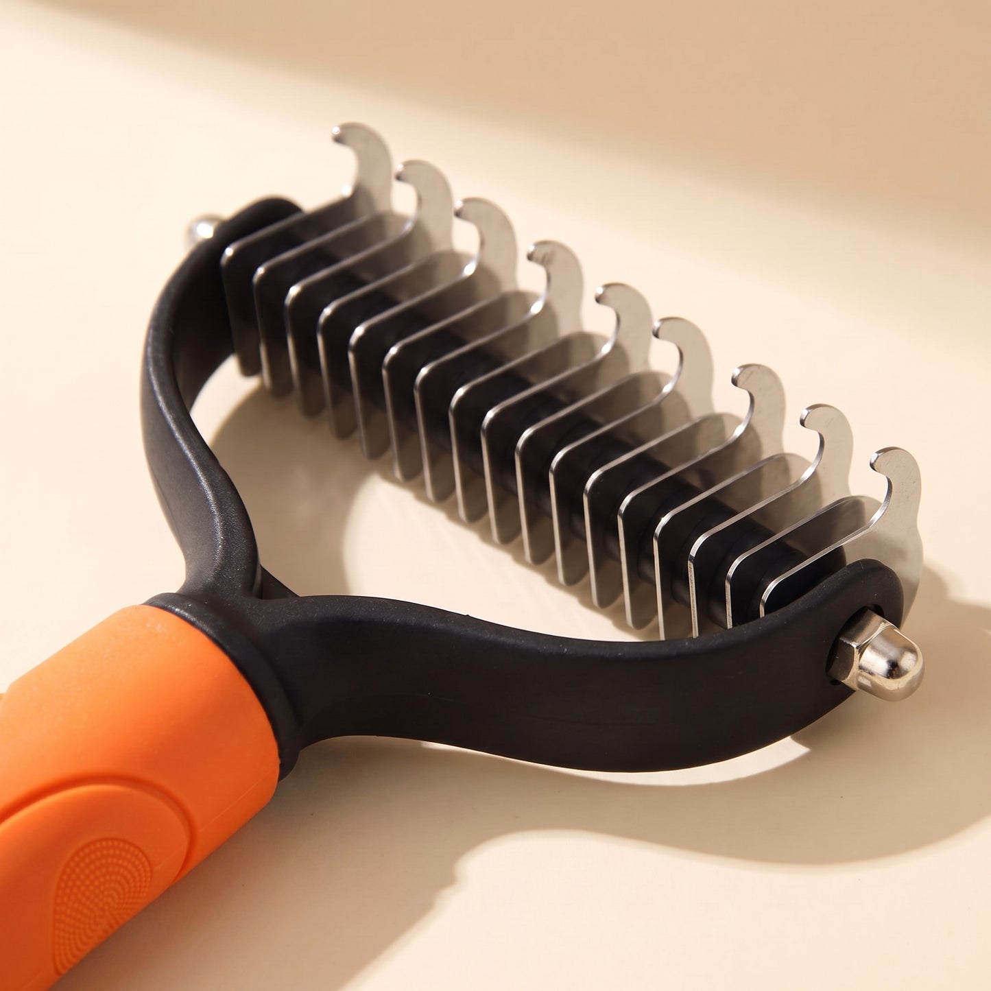 Extra-Wide Dual-Sided Dematting Brush in orange