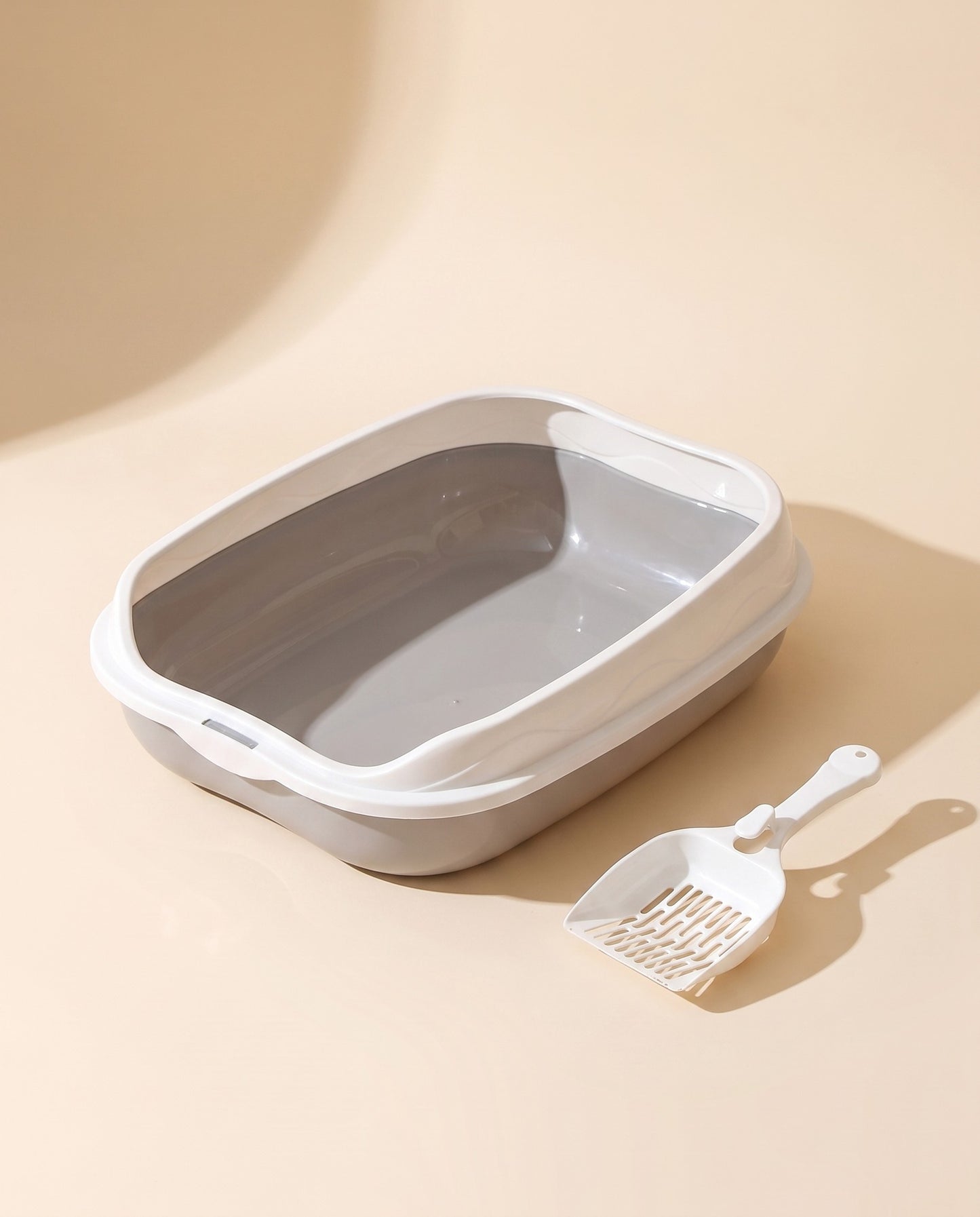 Splash-Proof High-Rim Litter Box, styled in a home setting