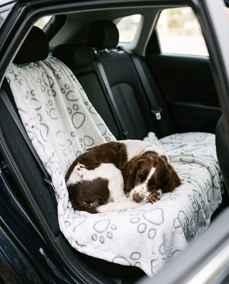 Covers a seat or a footwell