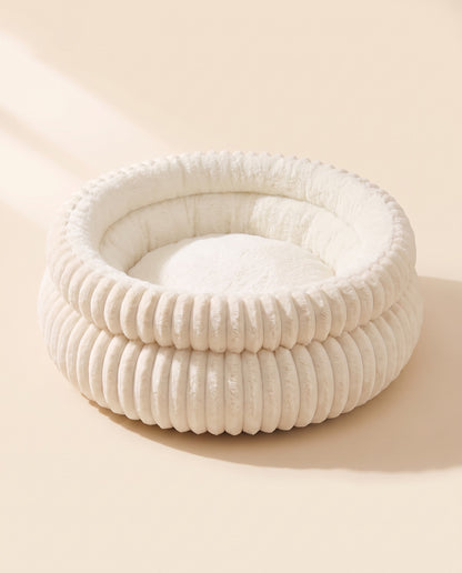 Corduroy Donut Cuddler Bed, styled in a home setting