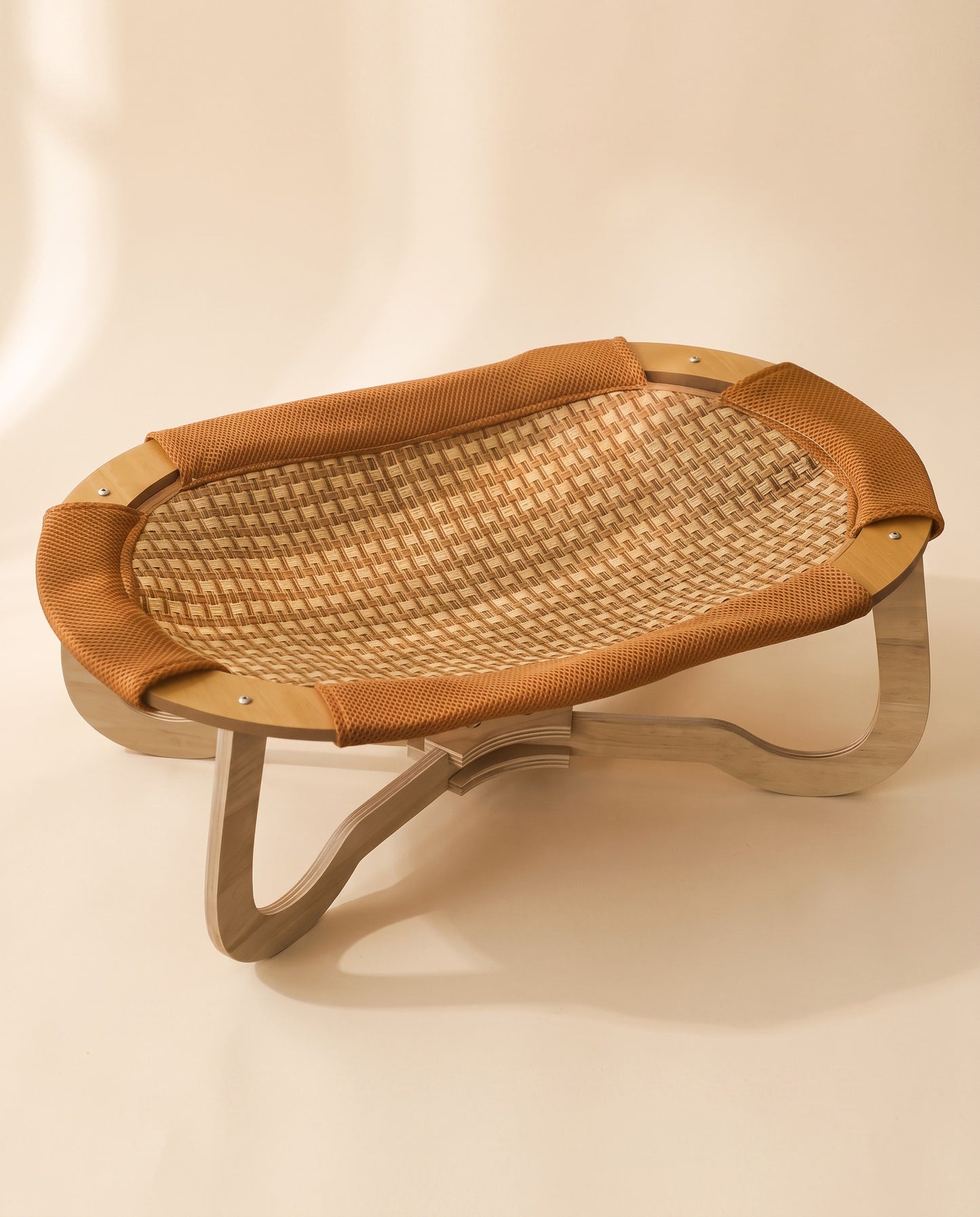 Elevated Woven Cooling Bed, styled in a home setting