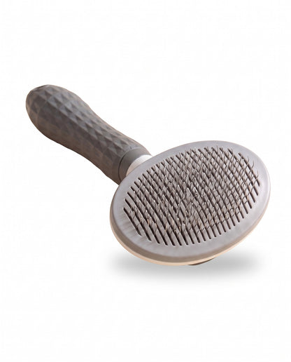 Self-Cleaning Slicker Brush, One-Click, styled in a home setting